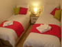 Photo of twin bedroom at Hideaway Cottage, Poole